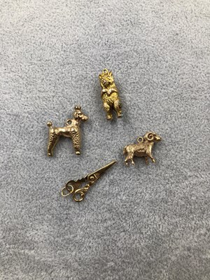 Lot 313 - Four gold charms. A 9ct hallmarked gold ram, a...