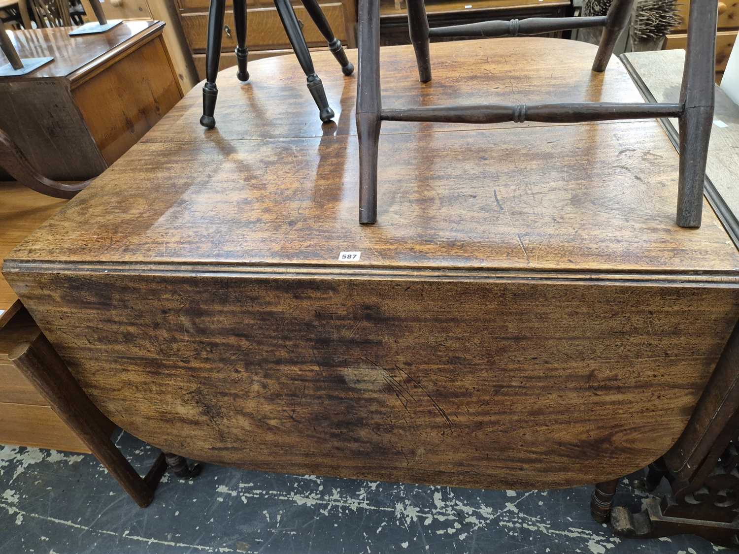 Lot 587 - A 19th century Mahogany drop leaf ding table...