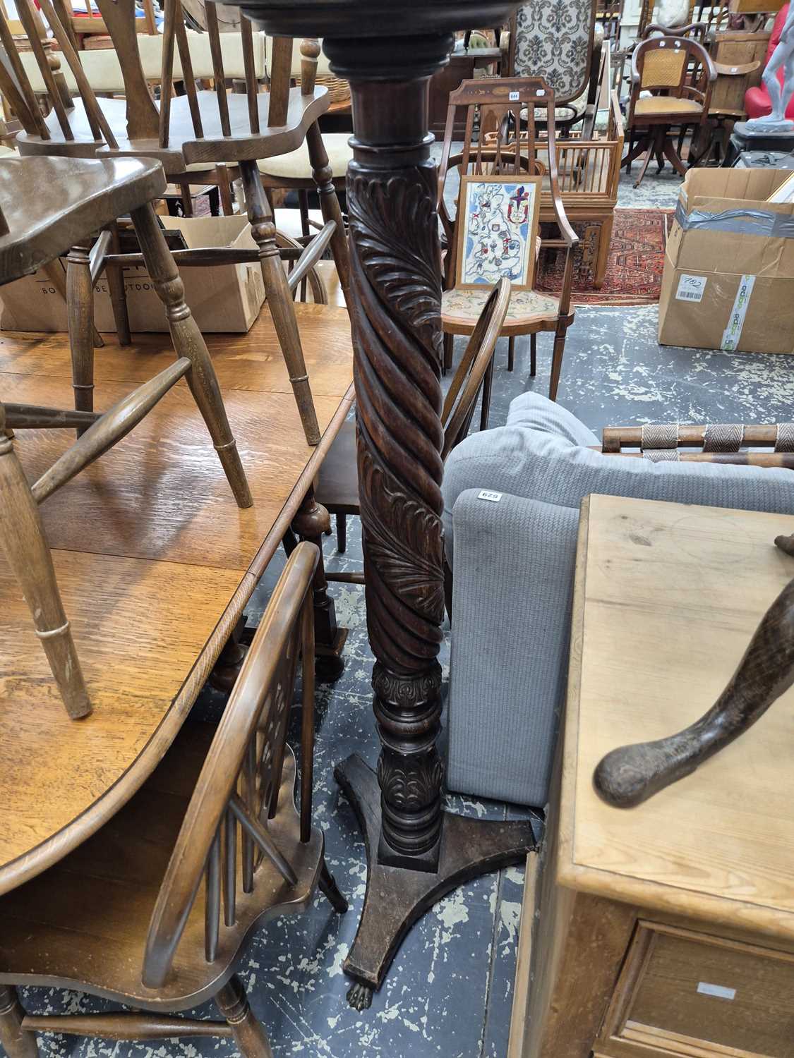 Lot 619 - A 19th century mahogany torchere.