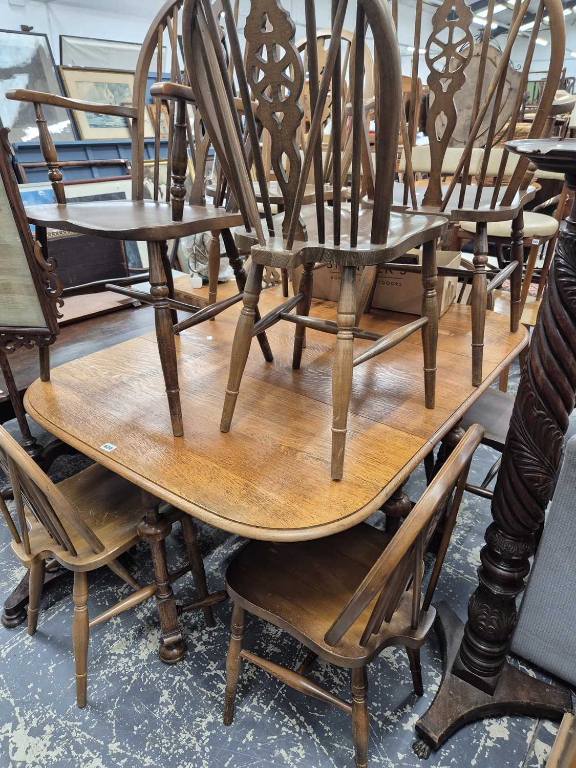 Lot 620 - A Large oak gateleg dining table. W 106 L...