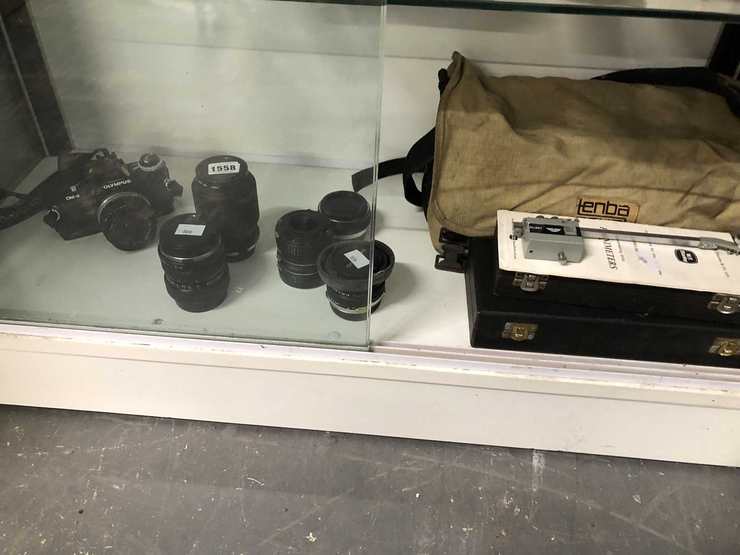 Lot 1558 - An Olympus OM4 camera, various lenses, a...