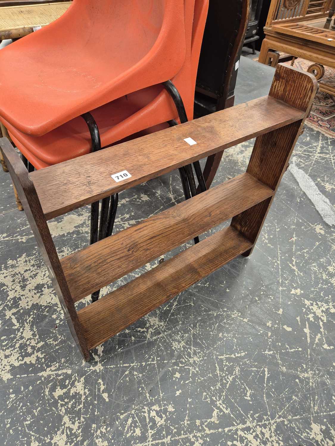 Lot 710 - A small oak wall shelf.