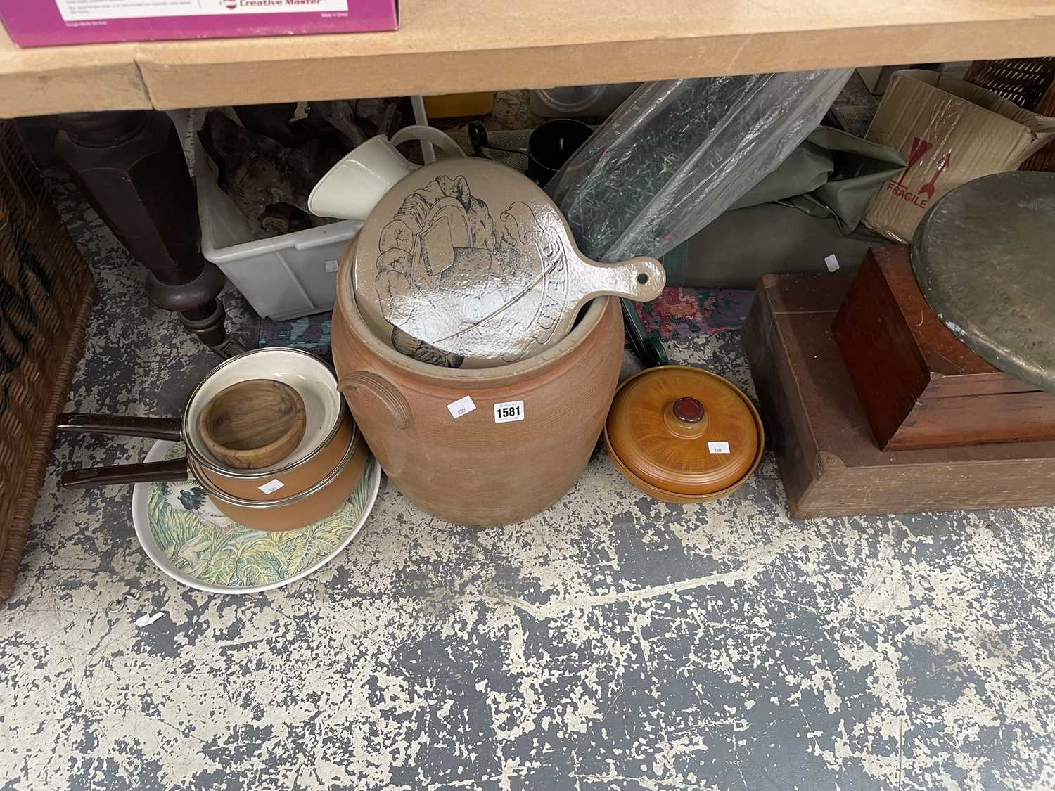 Lot 1581 - A stoneware bread bin, cooking pots, flan...