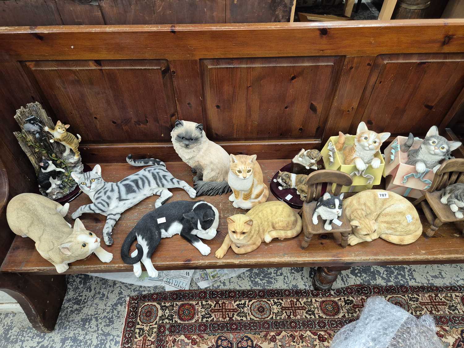 Lot 787 - A collection of ornamental cat figures.