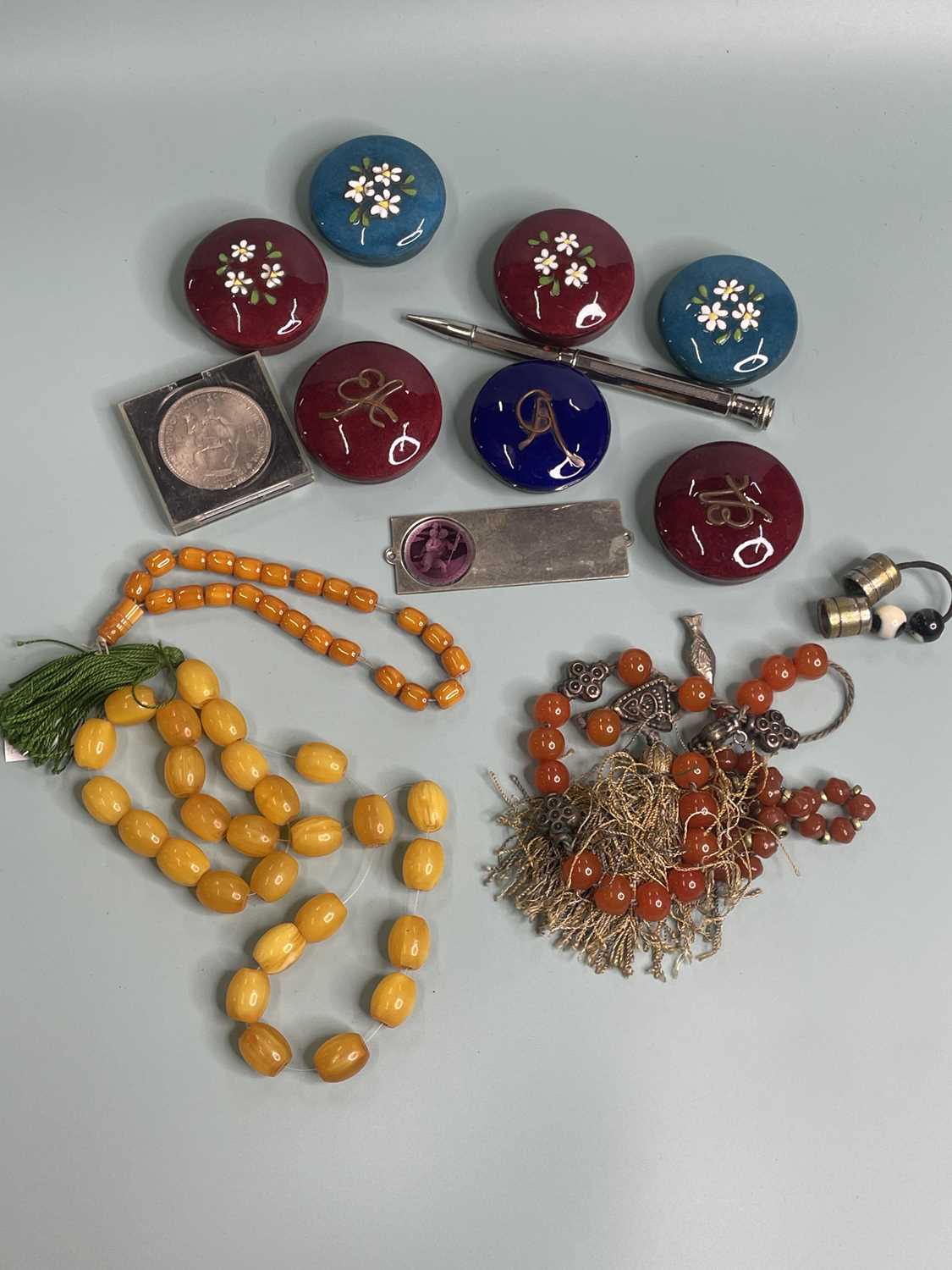 Lot 389 - Four strands of various prayer beads, seven...