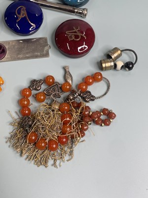 Lot 389 - Four strands of various prayer beads, seven...