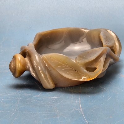 Lot 358 - A Chinese grey agate bowl carved with leaves...