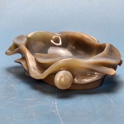 Lot 358 - A Chinese grey agate bowl carved with leaves...
