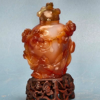 Lot 358 - A Chinese grey agate bowl carved with leaves...