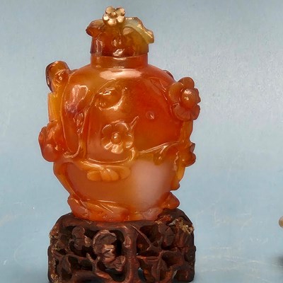 Lot 358 - A Chinese grey agate bowl carved with leaves...