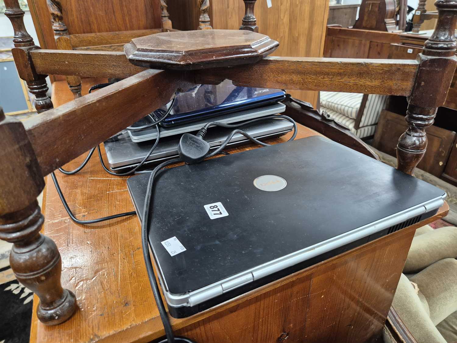 Lot 877 - Four vintage laptop computers.