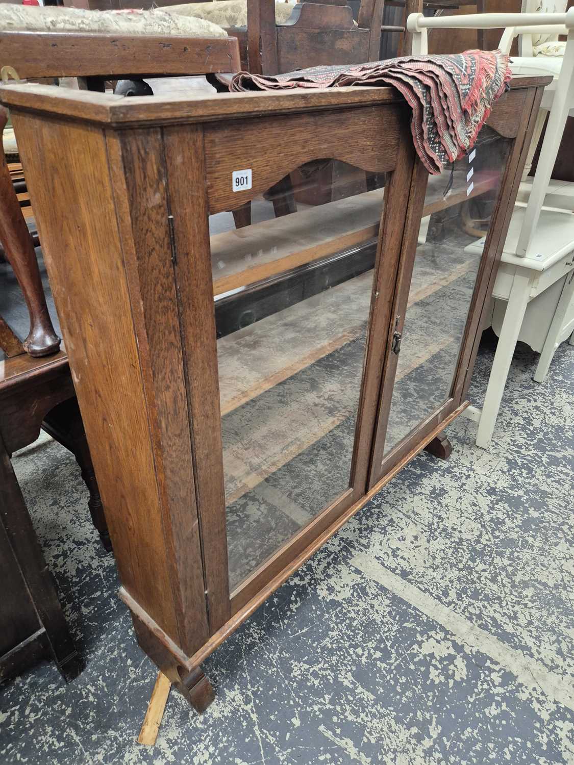 Lot 901 - A glazed bookcase cabinet.