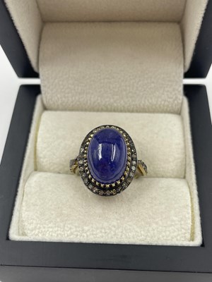 Lot 310 - A large cabochon tanzanite and rose-cut...