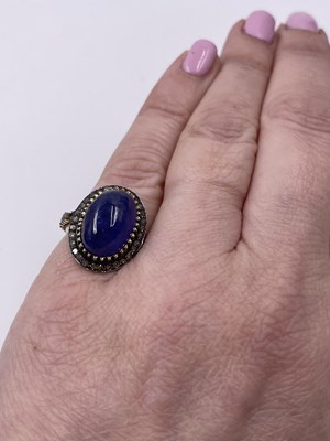 Lot 310 - A large cabochon tanzanite and rose-cut...