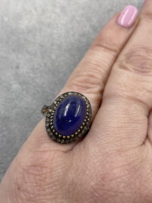 Lot 310 - A large cabochon tanzanite and rose-cut...