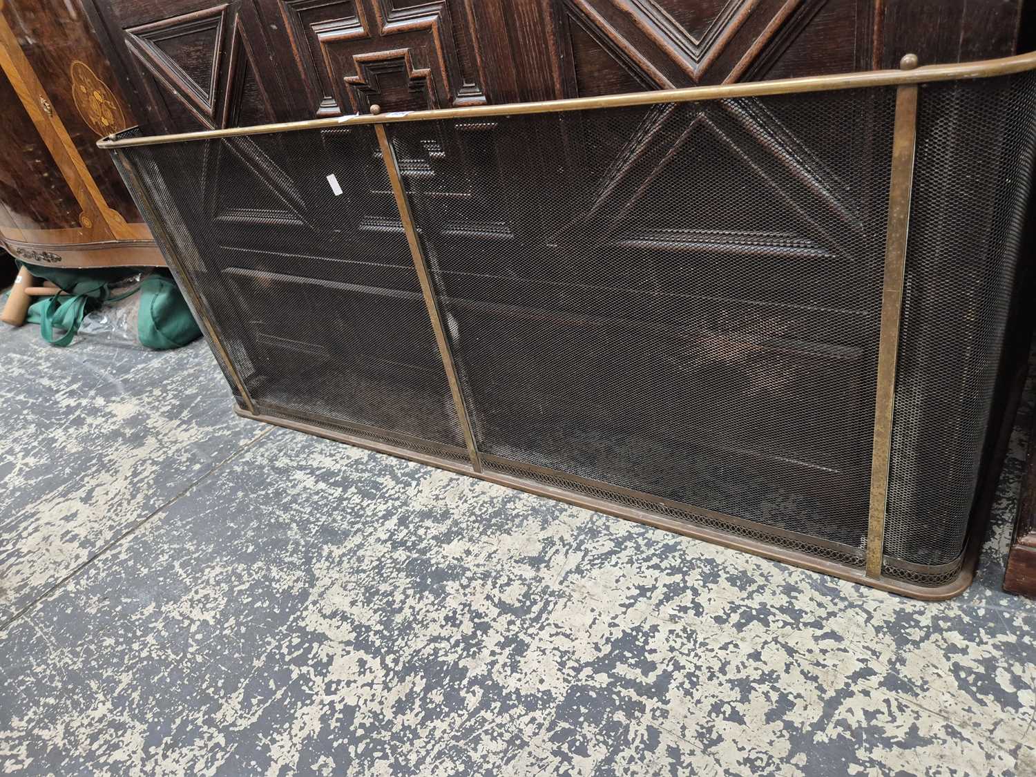 Lot 934 - A brass rail top fireguard. H 56 W 132 D 49cms