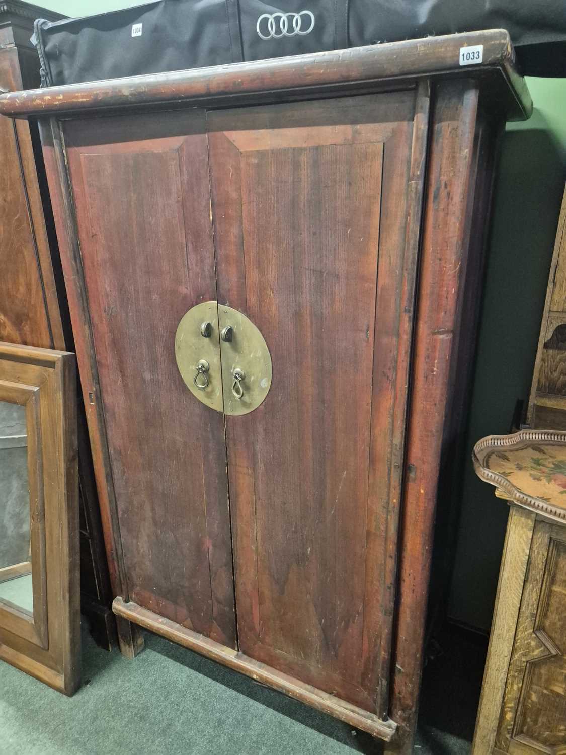 Lot 1033 - A Chinese two door robe cabinet. H 174 W 112 D...