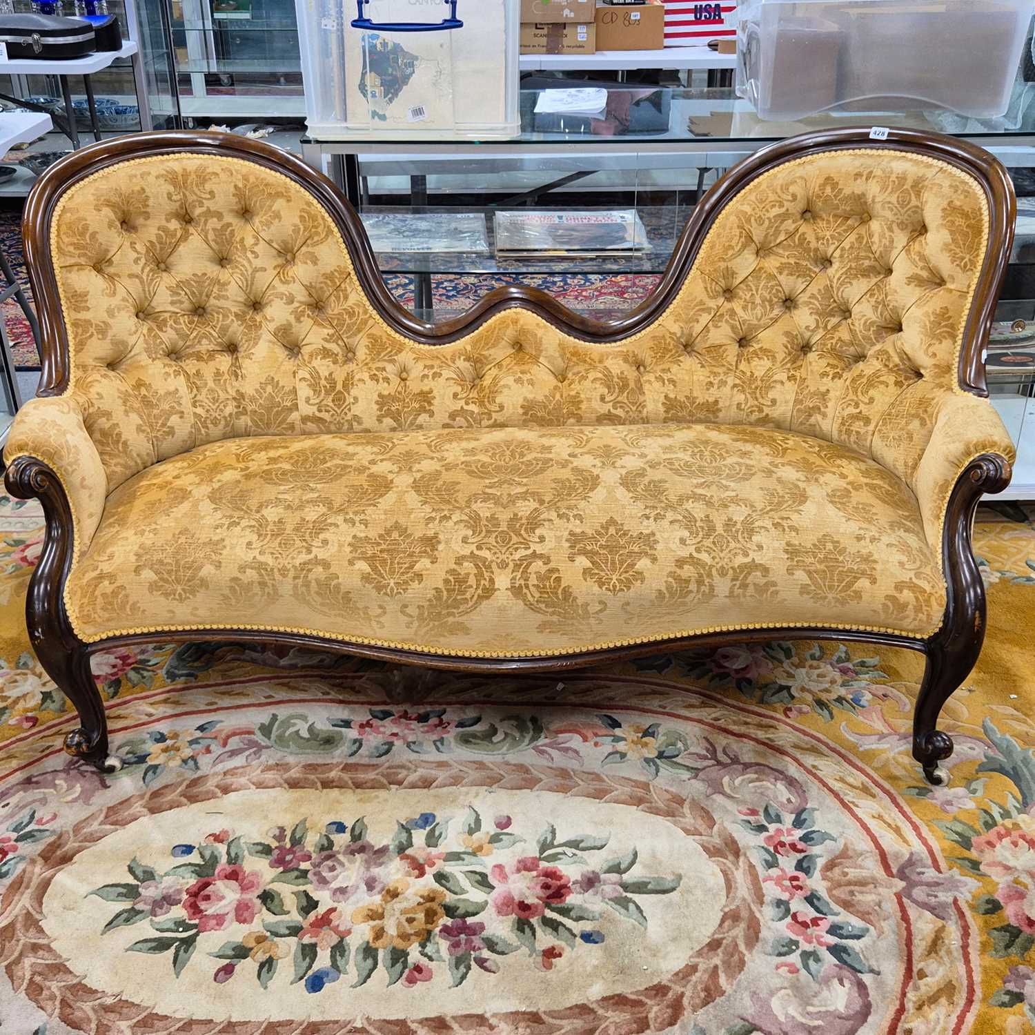 Lot 428 - A mahogany show frame twin button backed...