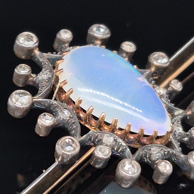 Lot 2 - An antique opal and diamond ornate bar brooch....