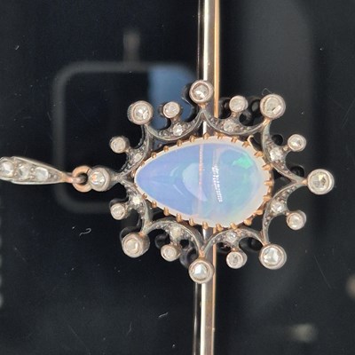Lot 2 - An antique opal and diamond ornate bar brooch....