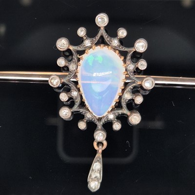 Lot 2 - An antique opal and diamond ornate bar brooch....