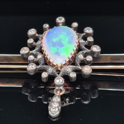 Lot 2 - An antique opal and diamond ornate bar brooch....