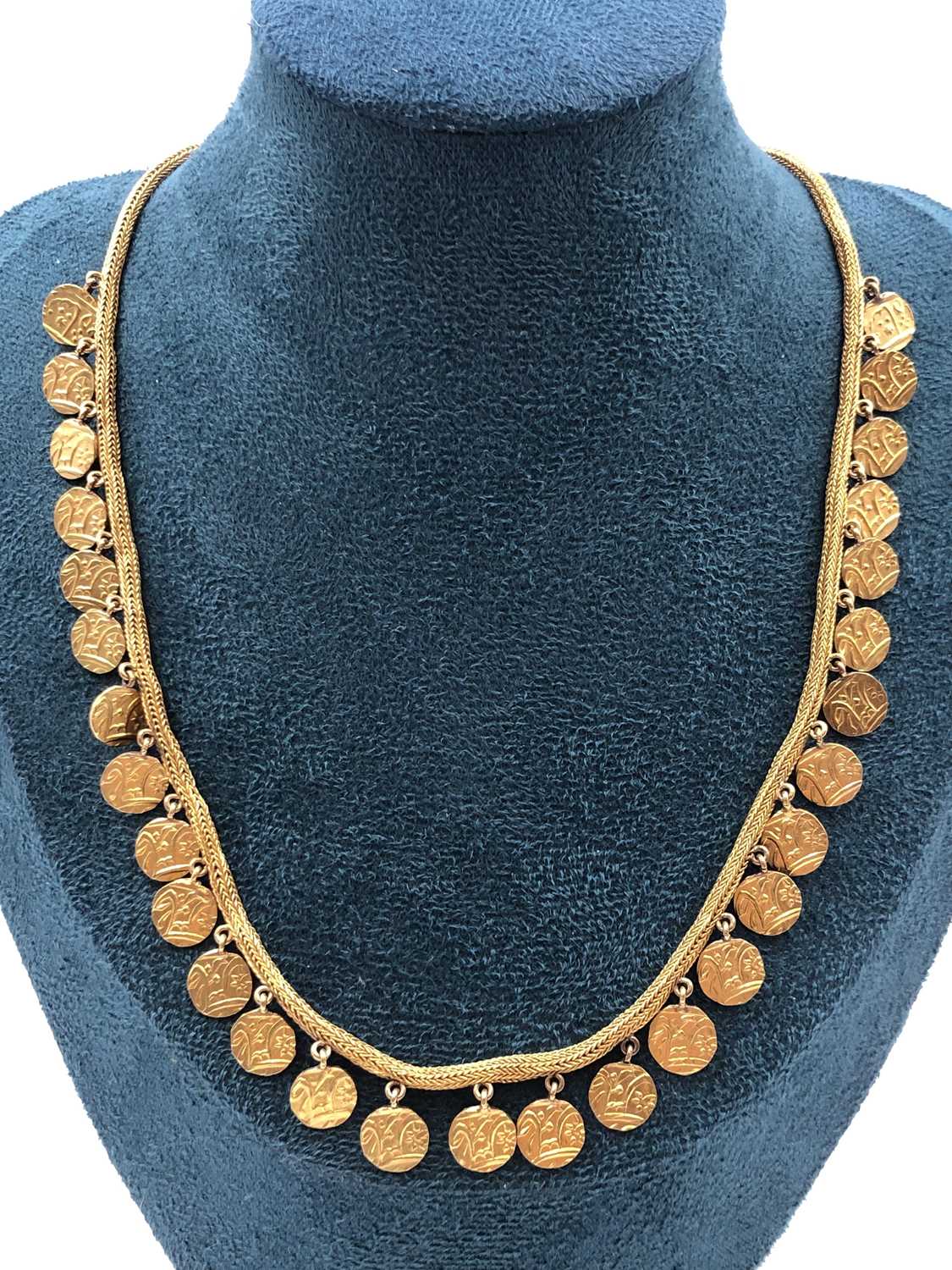 Lot 4 - An antique Indian heavy gold necklace fringed...