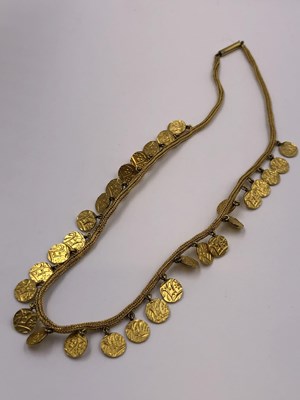 Lot 4 - An antique Indian heavy gold necklace fringed...
