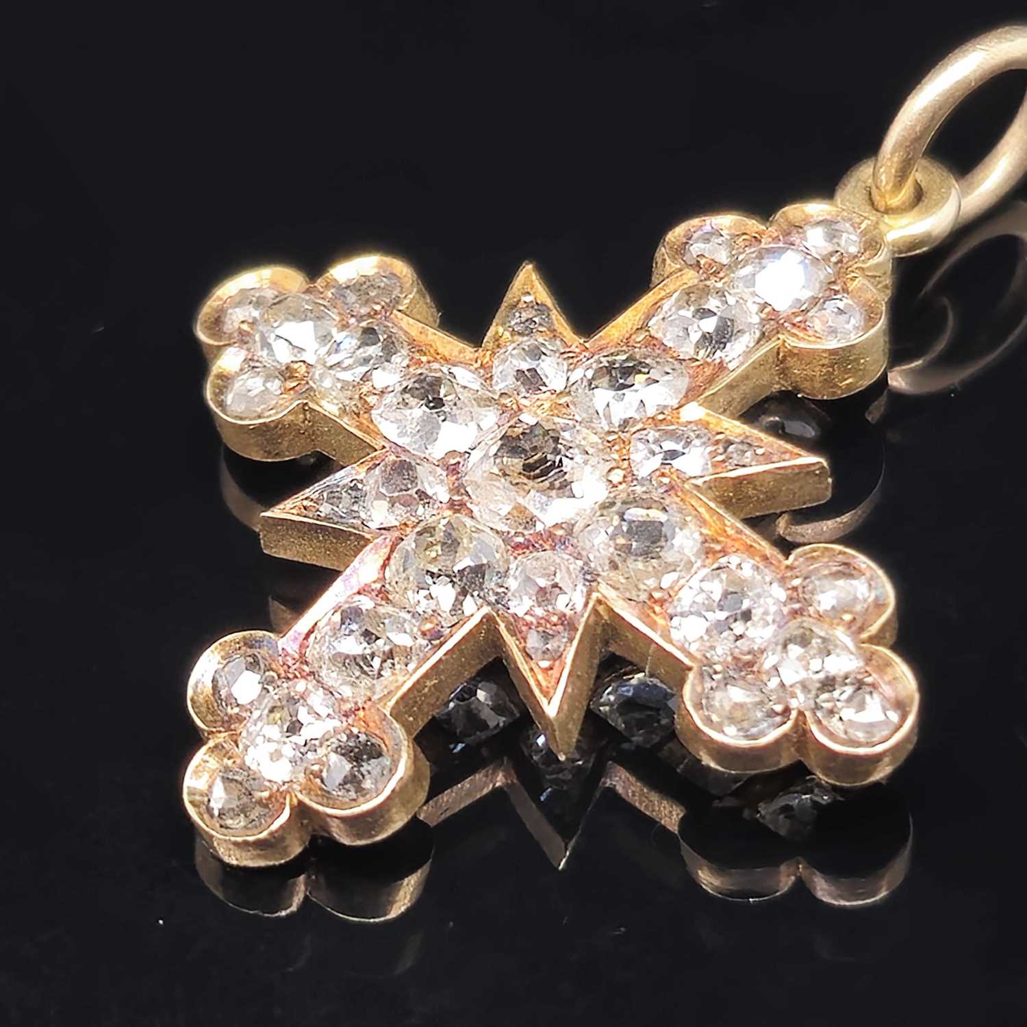 Lot 6 - An antique diamond cluster cross pendant, set...