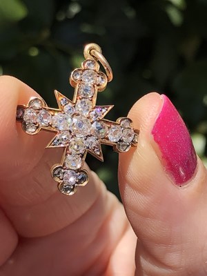 Lot 6 - An antique diamond cluster cross pendant, set...