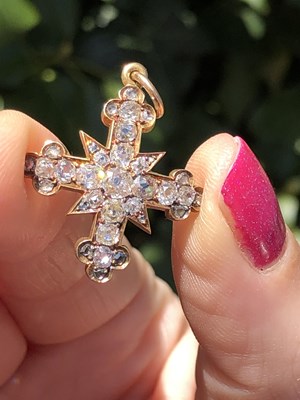 Lot 6 - An antique diamond cluster cross pendant, set...