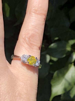 Lot 19 - A certificated fancy yellow diamond and...
