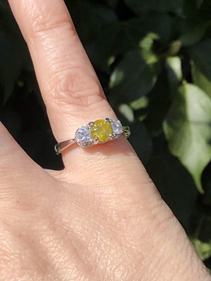 Lot 19 - A certificated fancy yellow diamond and...