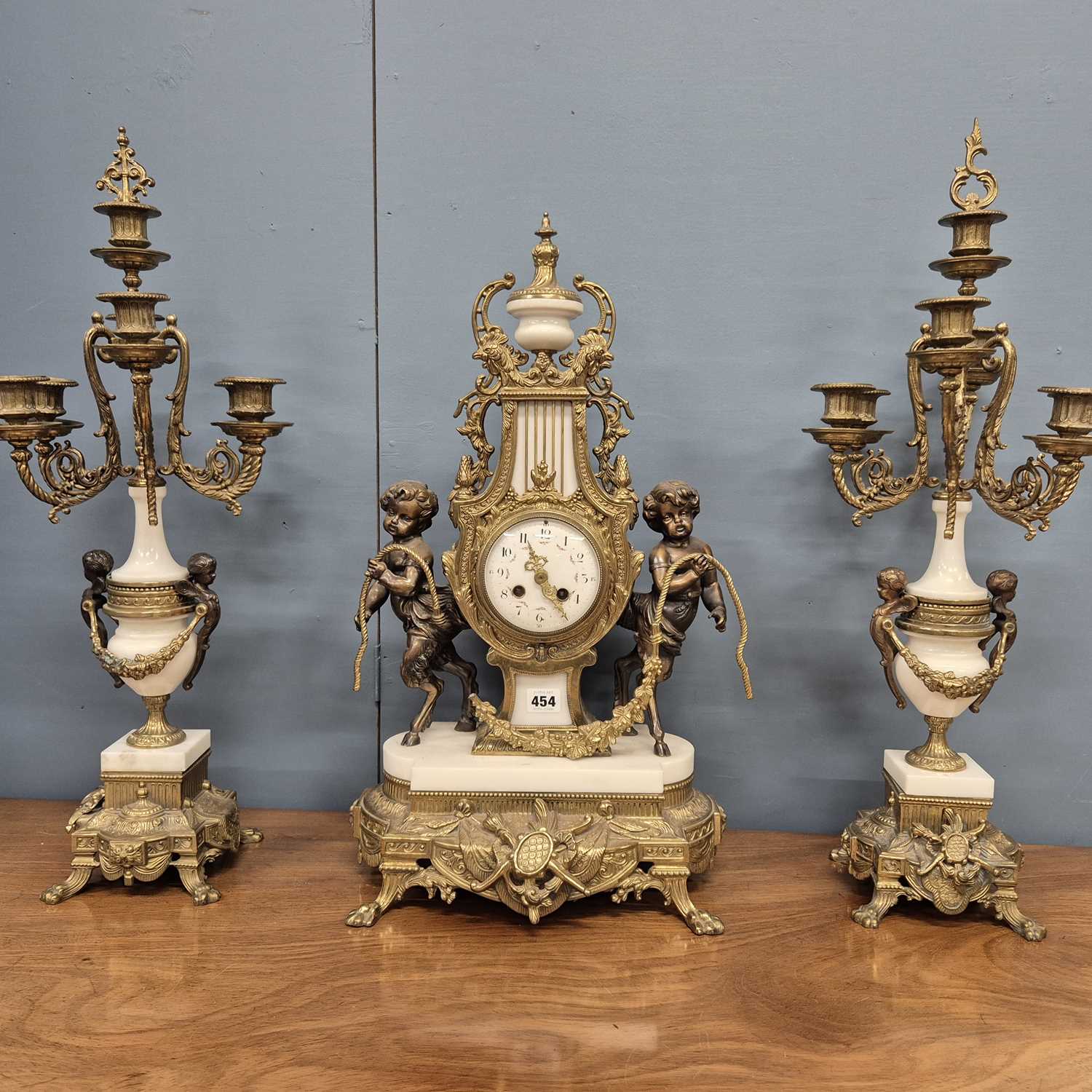 Lot 454 - An ormolu, bronze and white marble clock...