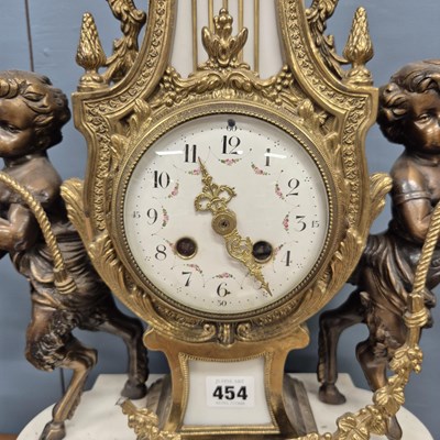 Lot 454 - An ormolu, bronze and white marble clock...