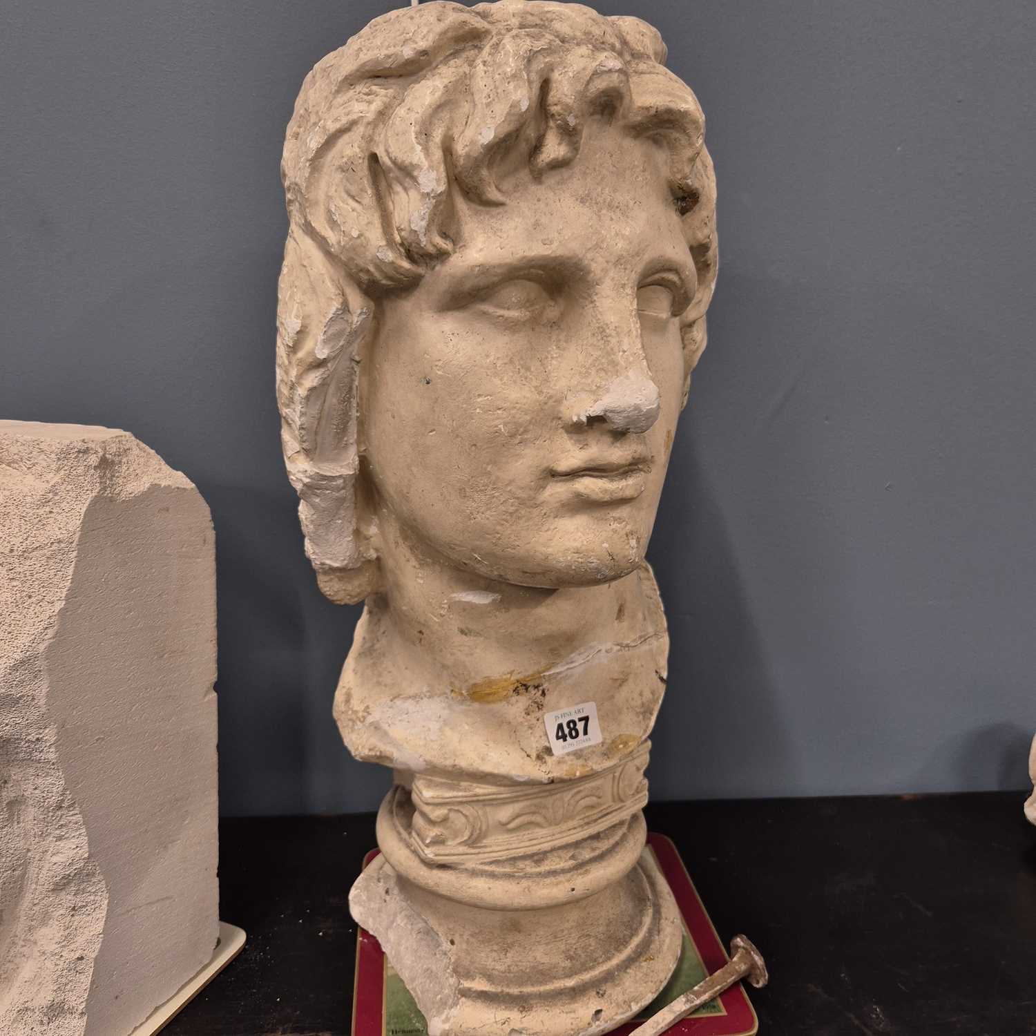 Lot 487 - A plaster bust of a classical male.   H 51cms....