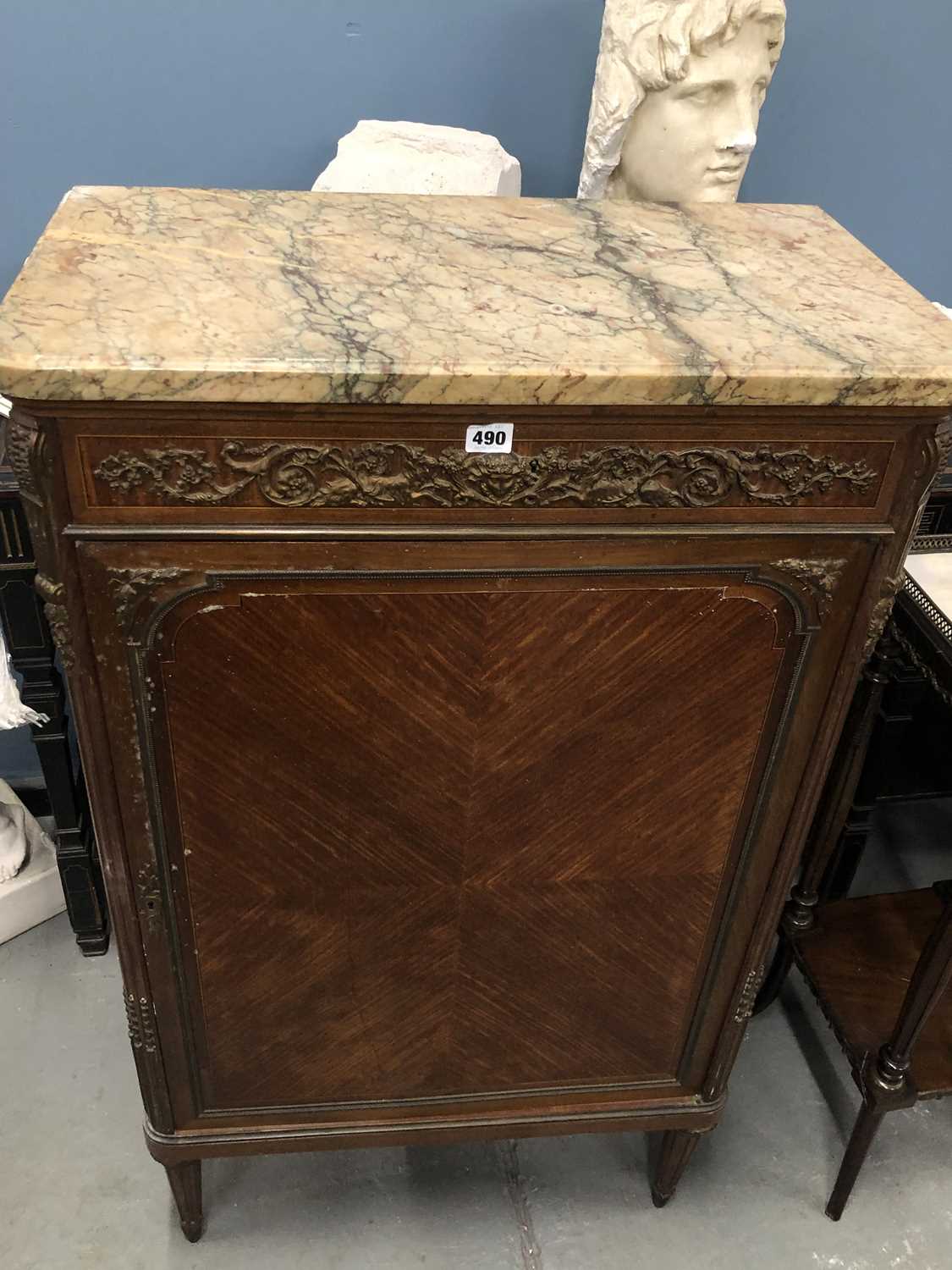 Lot 490 - A late 19th century French marble topped music...