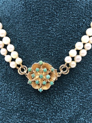 Lot 30 - A vintage two-row graduated pearl necklace...