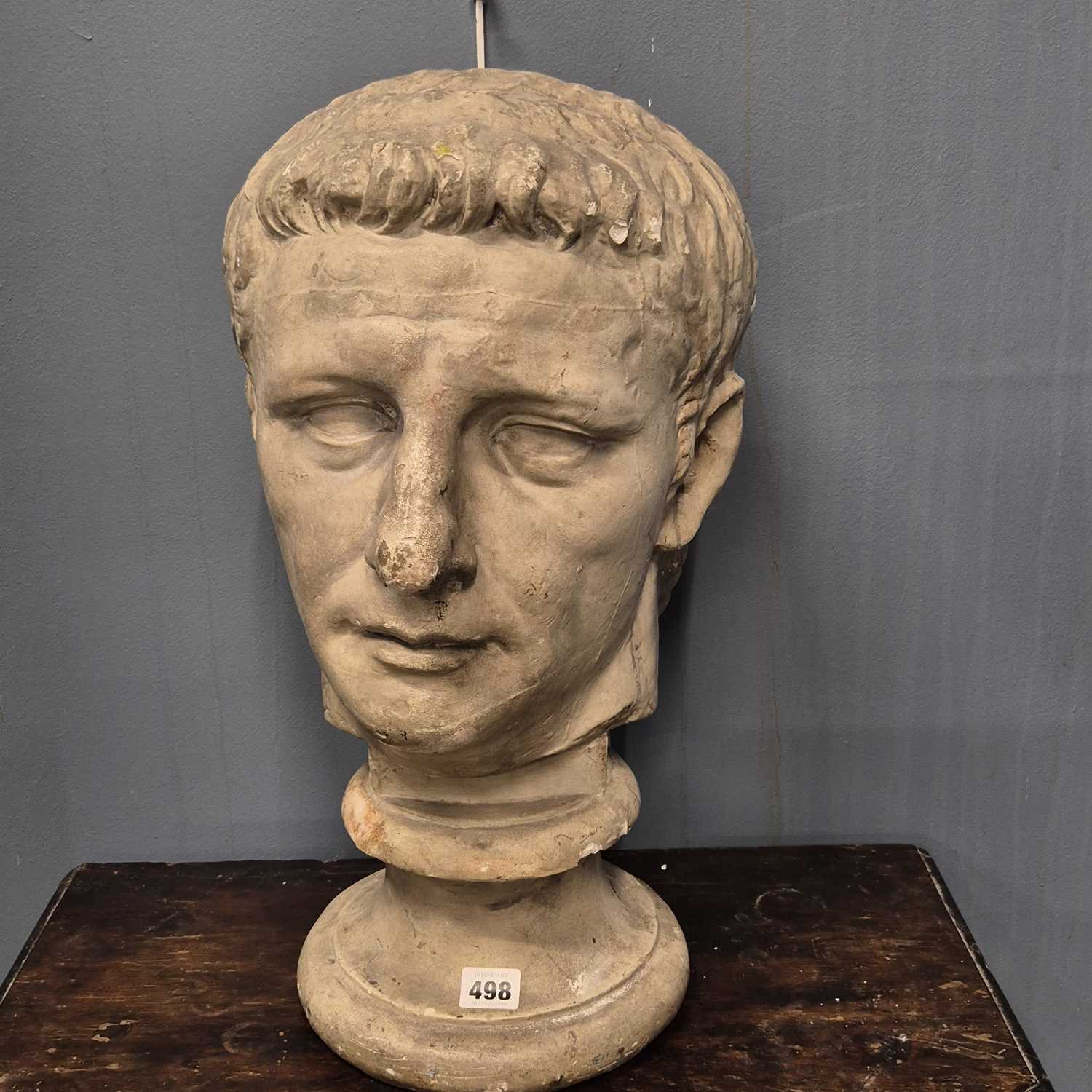 Lot 498 - A plaster bust of Augustus Caeser on a socle...