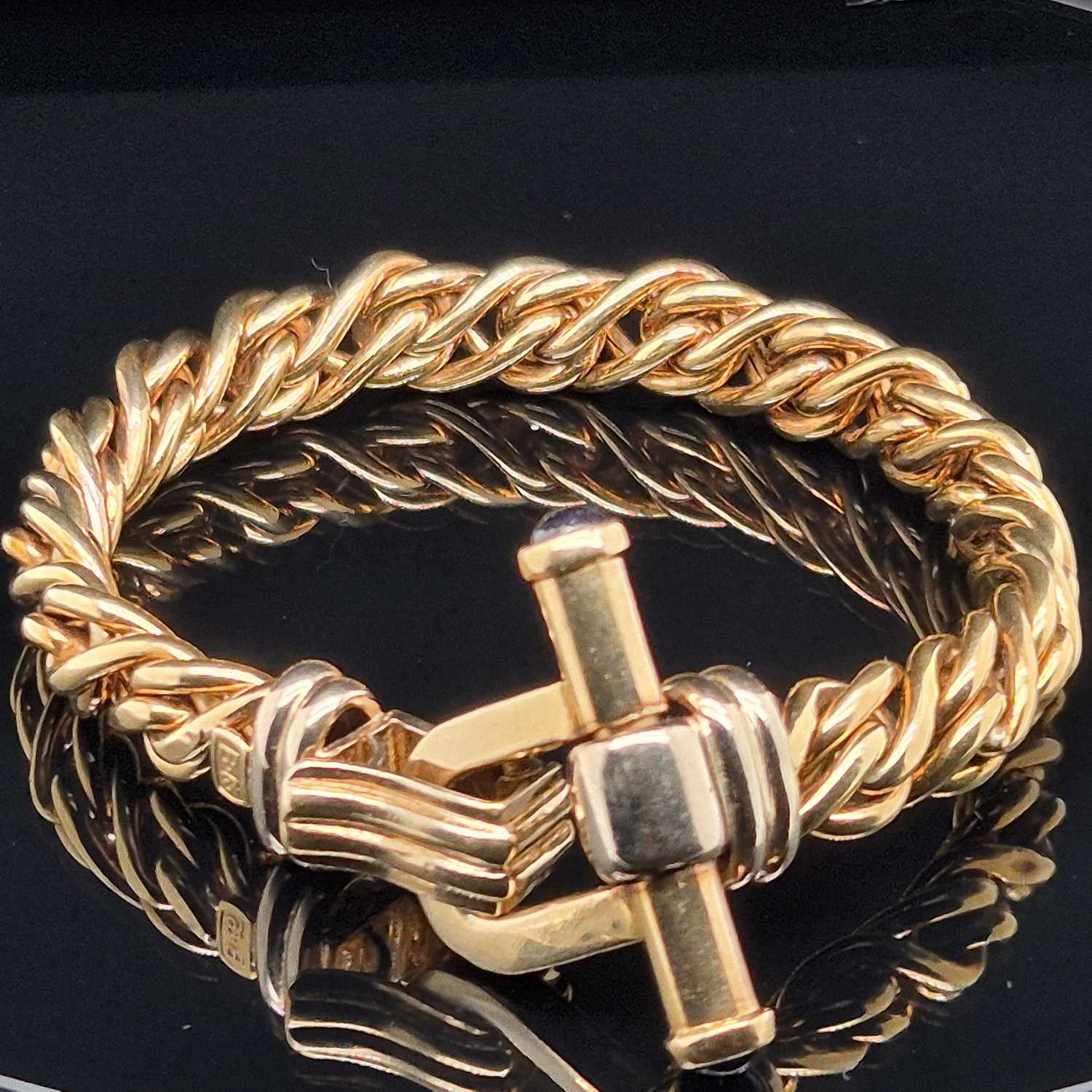 Lot 34 - An Italian woven link bracelet with gem-set...