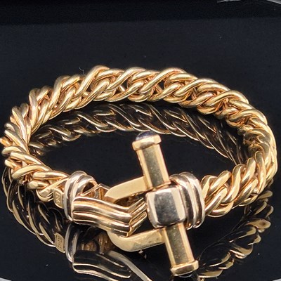 Lot 34 - An Italian woven link bracelet with gem-set...