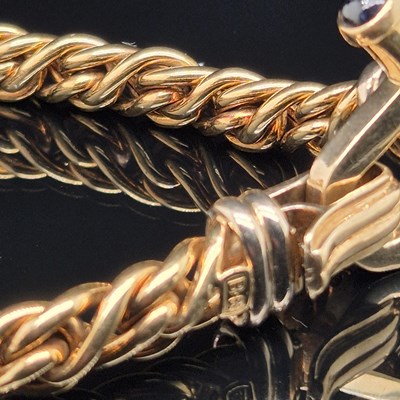 Lot 34 - An Italian woven link bracelet with gem-set...