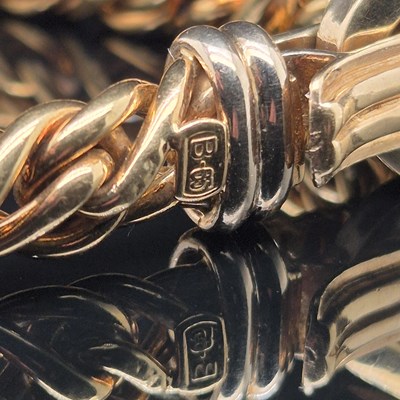 Lot 34 - An Italian woven link bracelet with gem-set...
