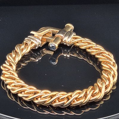 Lot 34 - An Italian woven link bracelet with gem-set...