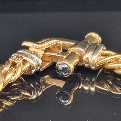 Lot 34 - An Italian woven link bracelet with gem-set...