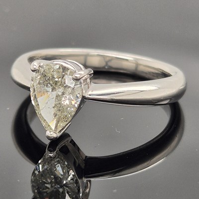 Lot 35 - A platinum hallmarked and pear-cut diamond...