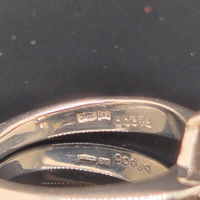 Lot 35 - A platinum hallmarked and pear-cut diamond...