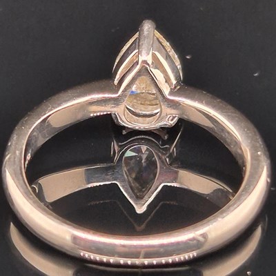 Lot 35 - A platinum hallmarked and pear-cut diamond...