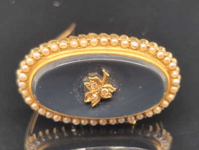 Lot 76 - An antique seed pearl, diamond and black...