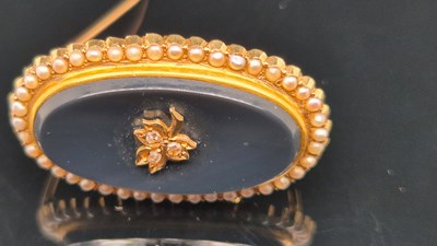 Lot 76 - An antique seed pearl, diamond and black...